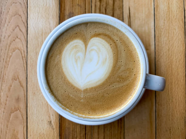 istock A cup of coffee latte on a wooden table 1446885441