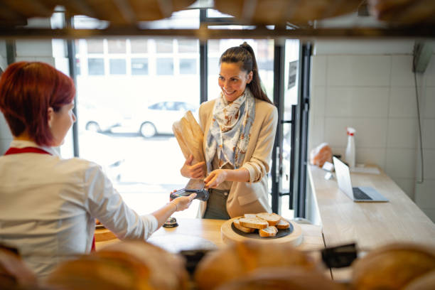 istock Customer buying and contactless paying in bakery 1446885469