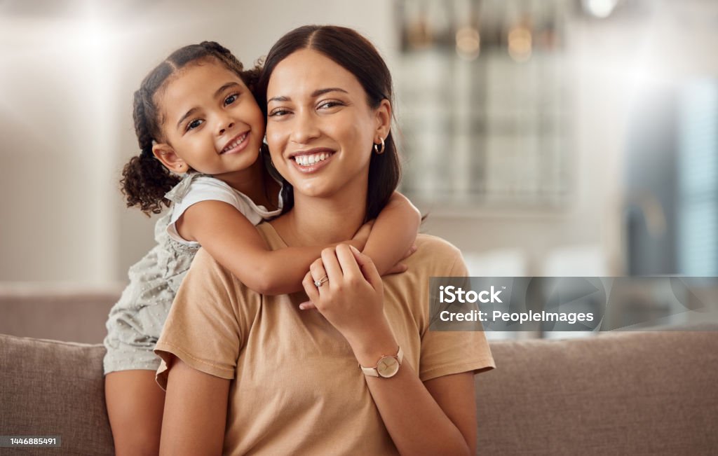Black family, hug and portrait of child with mother, mom or mama bond, relax and enjoy quality time together. Love, happy family and woman with kid girl smile, care or lounge on home living room sofa Mother Stock Photo