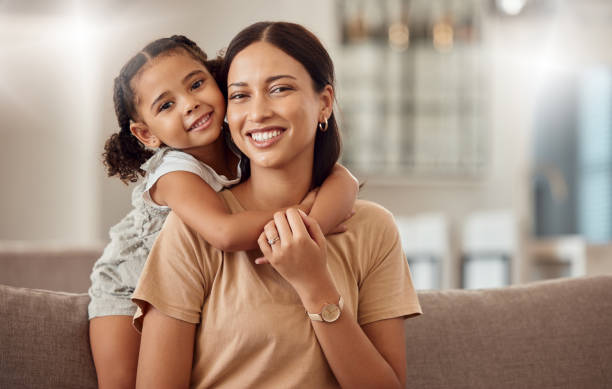 Black family, hug and portrait of child with mother, mom or mama bond, relax and enjoy quality time together. Love, happy family and woman with kid girl smile, care or lounge on home living room sofa Black family, hug and portrait of child with mother, mom or mama bond, relax and enjoy quality time together. Love, happy family and woman with kid girl smile, care or lounge on home living room sofa family cheerful happiness mother stock pictures, royalty-free photos & images