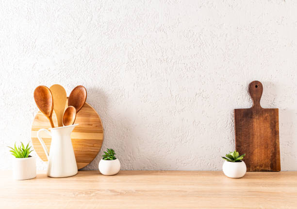 istock modern kitchen background with utensils on a wooden countertop against the textured wall. space for text. ECO items. 1446885758