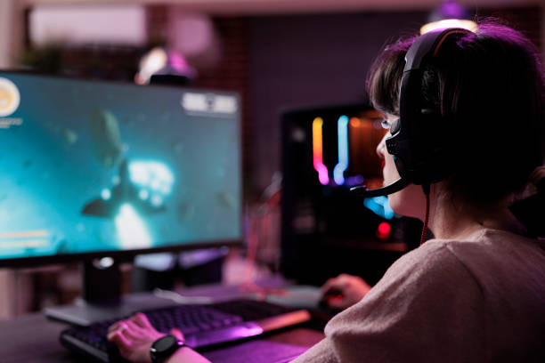 istock Young streamer playing video games online on live stream 1446885855