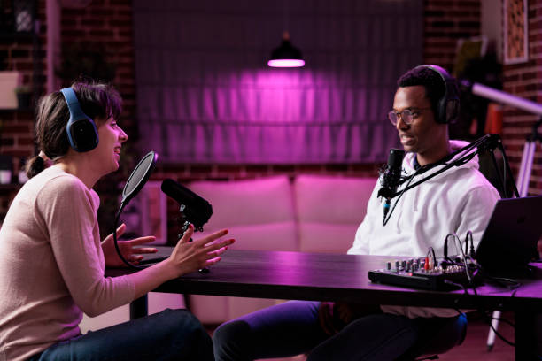 istock Content creator interviewing woman on online podcast 1446885872