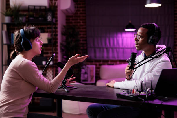 istock Diverse team of content creators streaming podcast show 1446886064