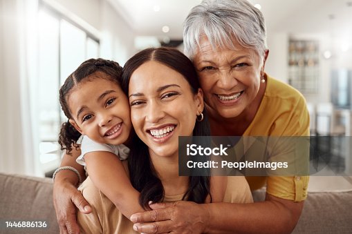 istock Child, mother and grandmother portrait while at home on sofa with smile, love and support sharing hug for generation of senior, woman and child. Portrait of brazil girls happy on mothers day together 1446886136