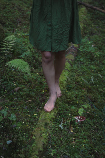 istock Close up barefoot walking in forest concept photo 1446887540
