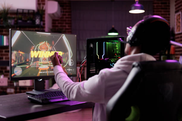 istock Happy player celebrating video games championship win 1446887677