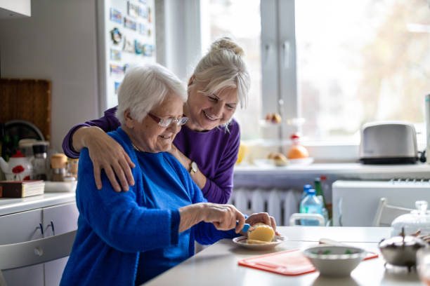 istock Woman spending time with her elderly mother at home 1446888327