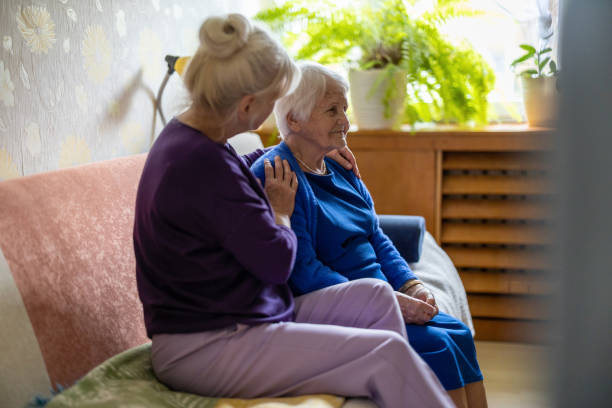 istock Woman spending time with her elderly mother at home 1446888352