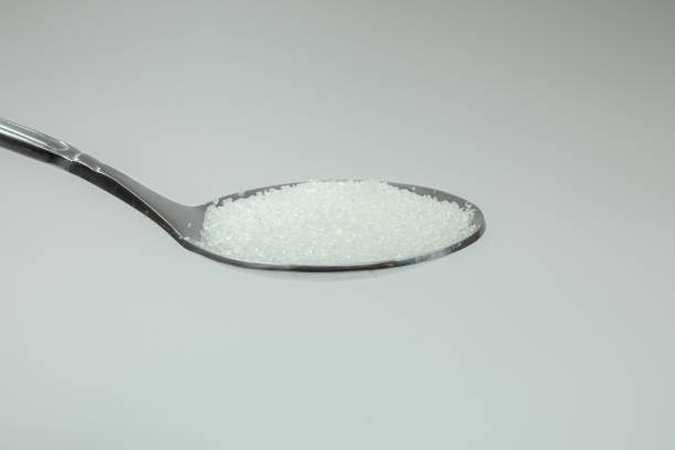istock a teaspoon of sugar with a white background 1446889365