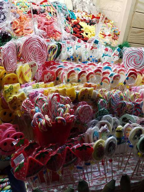 istock Sweets and candies. Sugar coated red apple. Kids fair. 1446889876