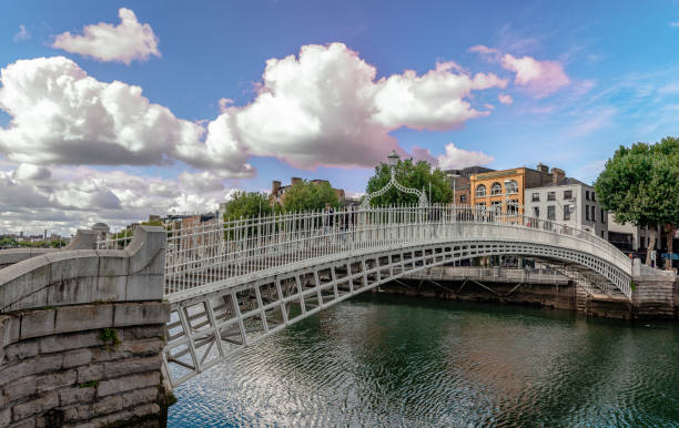Dublin, Ireland - September 16 2022: The Ha'penny Bridge, officially the Liffey Bridge. It is a cast iron pedestrian bridge, built in 1816 over the River Liffey.