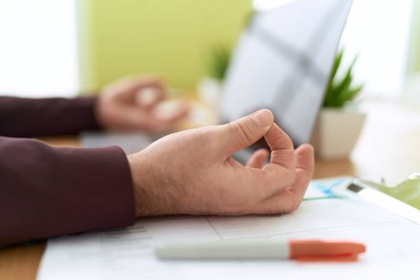 istock Middle age man business worker doing yoga exercise at office 1446891397