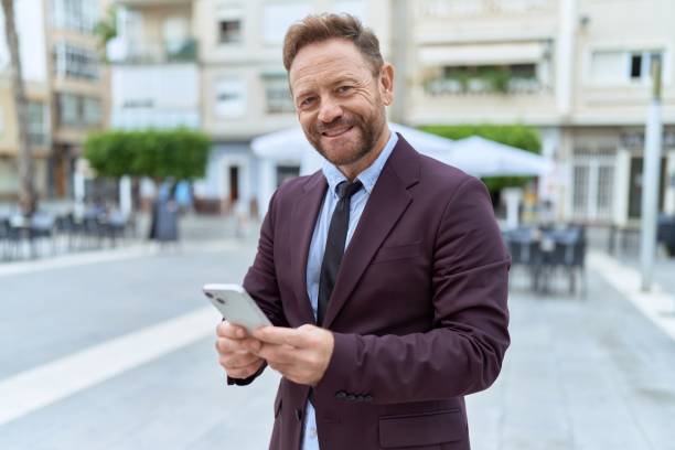 istock Middle age man business worker smiling confident using smartphone at coffee shop terrace 1446891398
