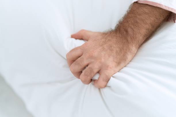 istock Middle age man having orgasm on bed at bedroom 1446891429