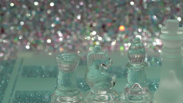 Glass chess pieces with light background