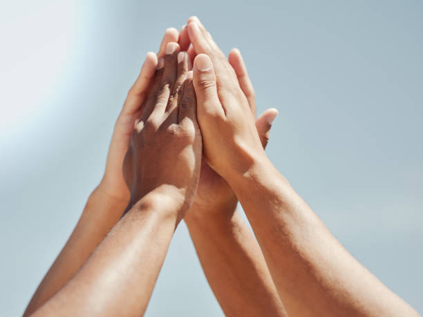 istock Hands, high five or teamwork collaboration success in fitness, workout or training match or summer game. Zoom, men or sports diversity support in team building for community security or friends trust 1446894832