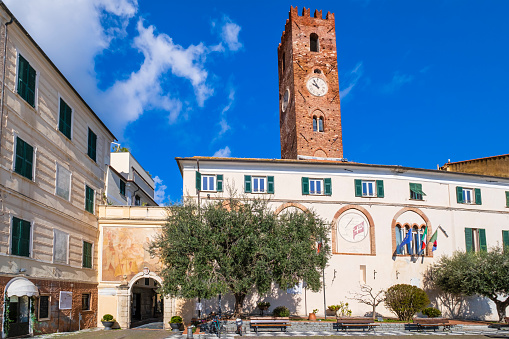 Glimpse of the historic borough of Noli, with the Porta di Piazza and the town hall