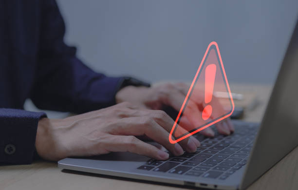 istock Warning alert system concept, system hacked on computer network, cybercrime and virus, Malicious software, compromised information, illegal connection, data breach cybersecurity vulnerability 1446896271