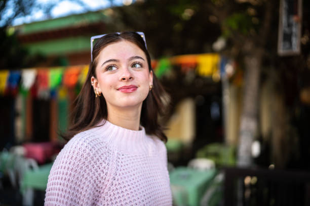Young woman looking away outdoors