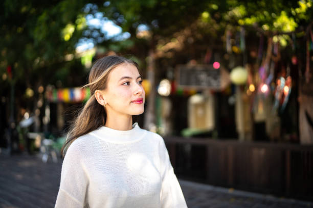 istock Young woman looking away outdoors 1446896721