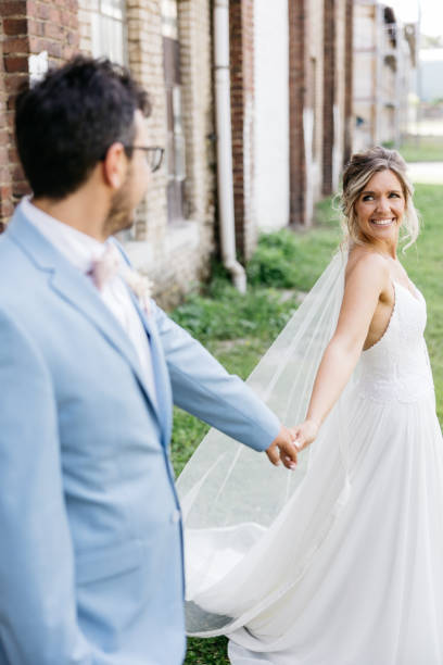 istock bride looks at her groom 1446897371