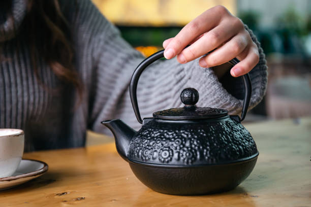 istock Cast iron black Turkish teapot close-up on the table. 1446897456