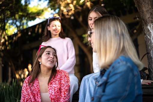 Young women having a conversation outdoors