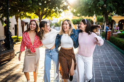 Young women walking together outdoors