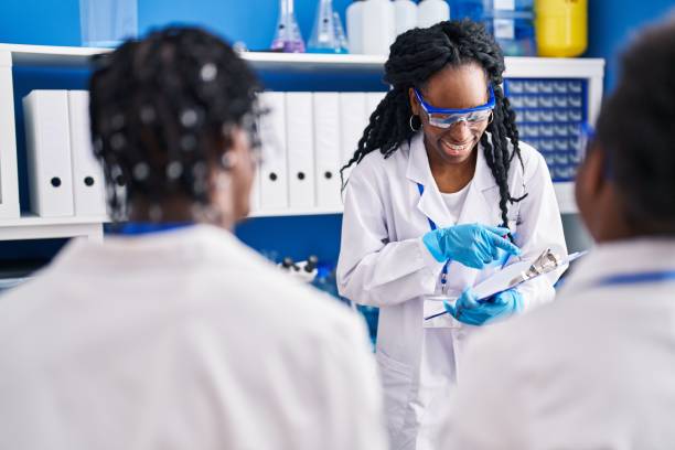 istock African american friends scientists explaining experiment at laboratory 1446899167