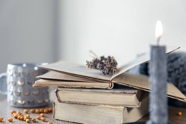 istock Cozy home composition with a stack of books on a blurred background. 1446899766