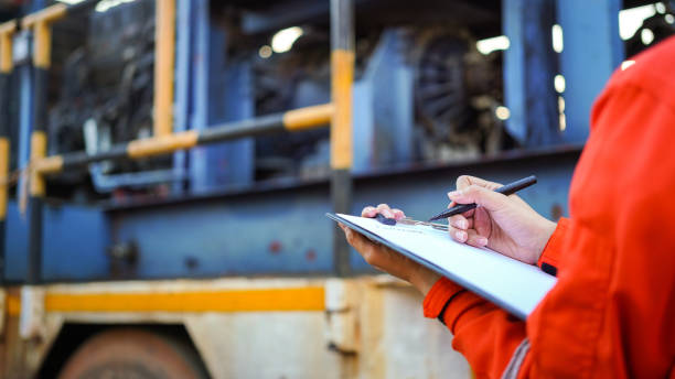 istock Writing on the preventive maintenance checklist of the heavy machine. 1446902891