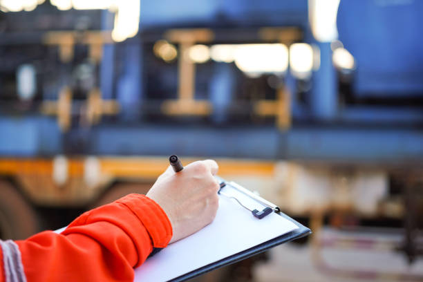 istock Writing on the preventive maintenance checklist of the heavy machine. 1446902931