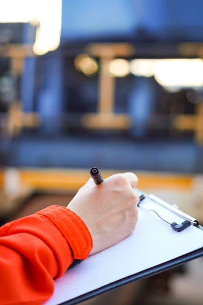 istock Writing on the preventive maintenance checklist of the heavy machine. 1446902932