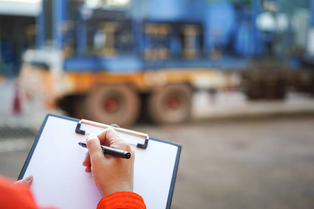 istock Writing on the preventive maintenance checklist of the heavy machine. 1446902938