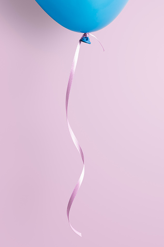 Blue balloon on pink background. This file is cleaned, retouched and contains clipping path.