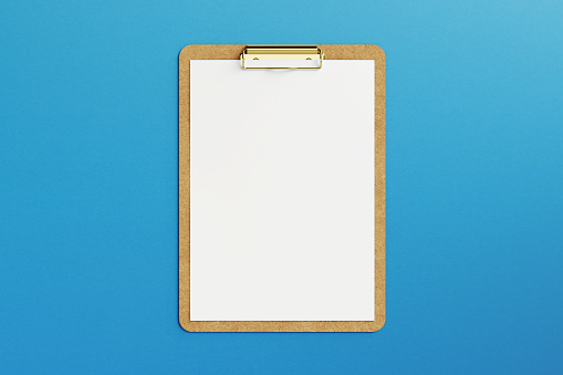 Clipboard with blank note paper on blue background