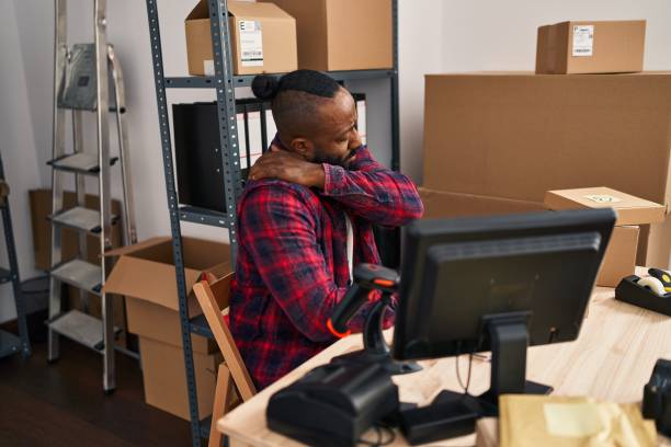 istock Young african american man ecommerce business worker suffering for backache at office 1446905665