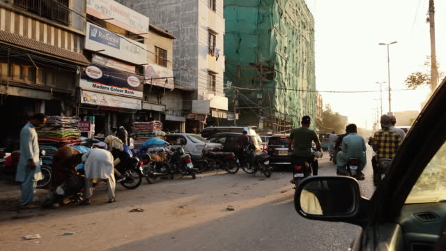 The streets of Karachi city at the sunset