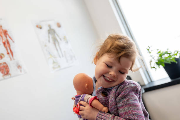 istock child with doll at doctors office 1446907800