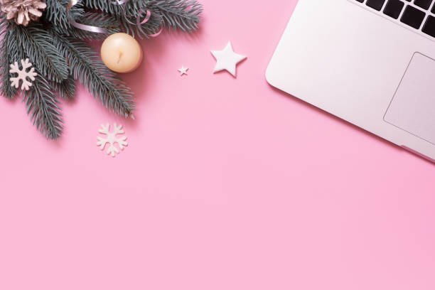 istock Blank work table and Cristmas New Year decoration top view, flat lay on pink background. Business xmas concept. 1446908175