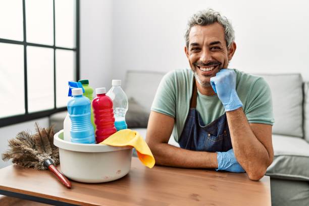 istock Middle age grey-haired man smiling confident leaning on table at home 1446909614