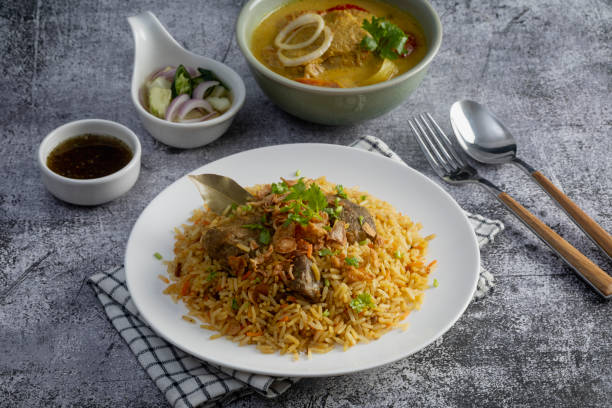 istock Beef Biryani or Curried rice and beef - Thai-Muslim version of Indian biryani, with fragrant yellow rice and beef - Muslim food style 1446910832