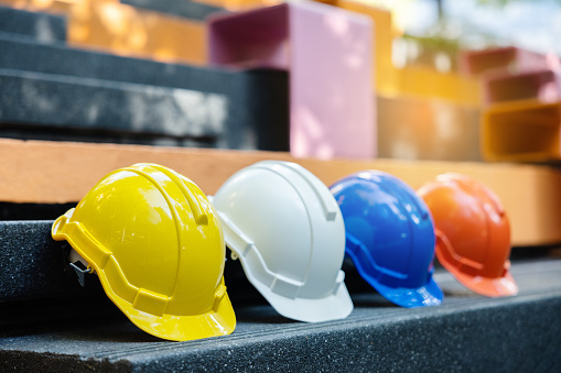 Helmets for construction workers, engineers, technicians, inspectors who work on construction sites. Safety hardhat while working to prevent accidents. work equipment of Blue collar