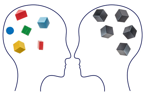 The concept of rational and irrational thinking of two people. Heads of two people with colourful and black shapes of abstract brain, two people with different thinking.