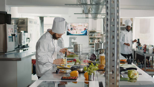 istock Professional cook using grater to make shredded cheese 1446914036
