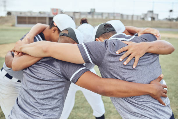 istock Huddle, baseball teamwork and team on baseball field ready for game, match or competition. Training, exercise and crowd of baseball players together for motivation, team building or winning mindset. 1446914096