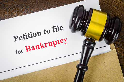 Bankruptcy filing petition and a court gavel.