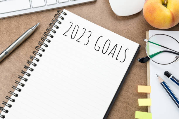 istock Notebook with 2023 goals text on it to apply new year resolutions and plan. 1446916481