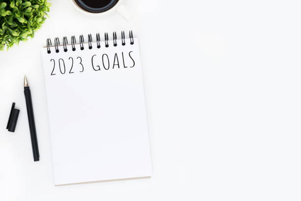 istock Notebook with 2023 goals text on it to apply new year resolutions and plan. 1446916510